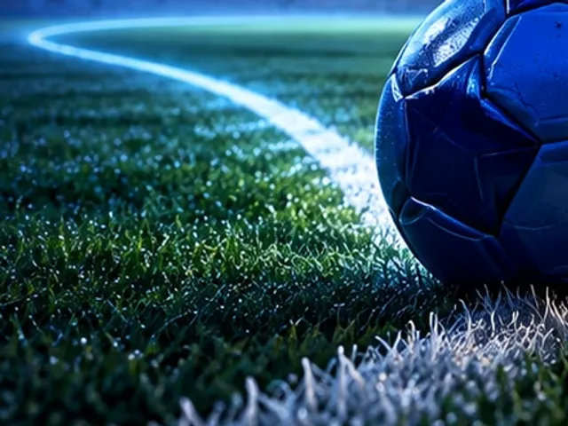 Football on the pitch under stadium lights