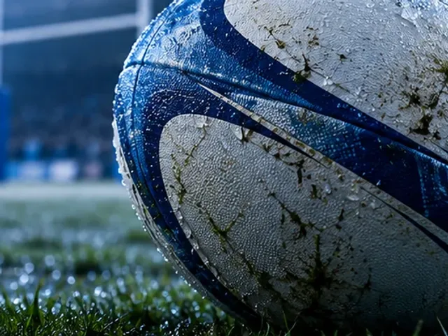 Rugby ball on a floodlit pitch